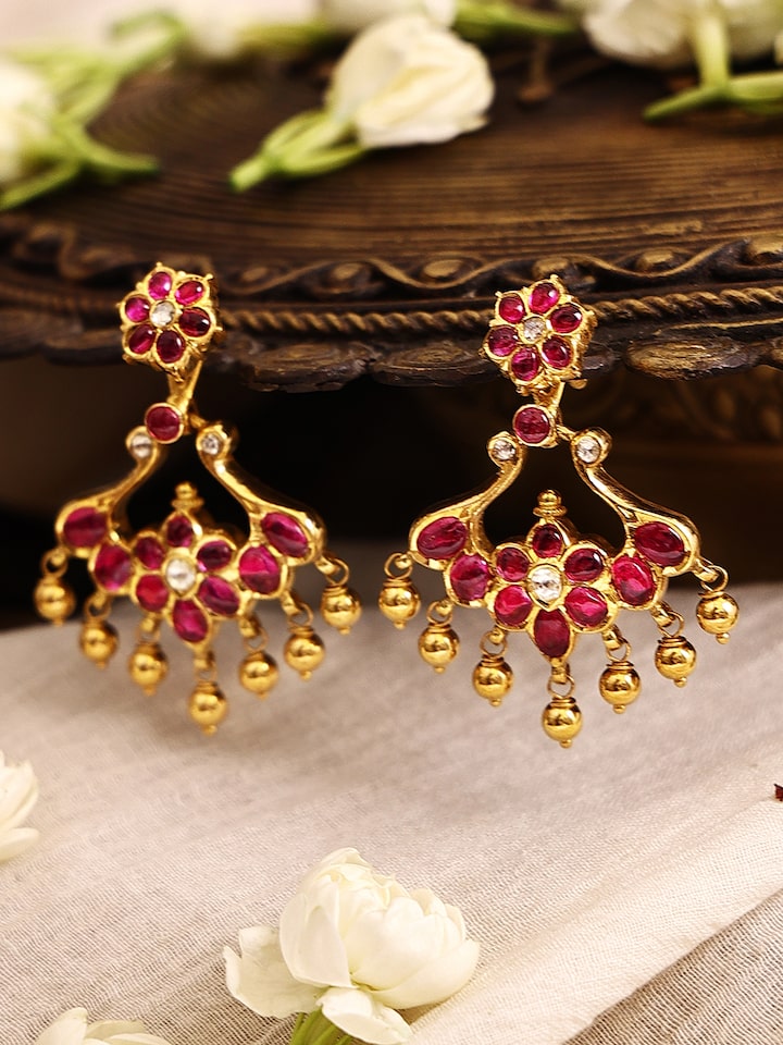 Angled view of Kundala Velai 22 Karat Gold Jhumkas emphasizing the traditional jhumka style and fine goldwork.
