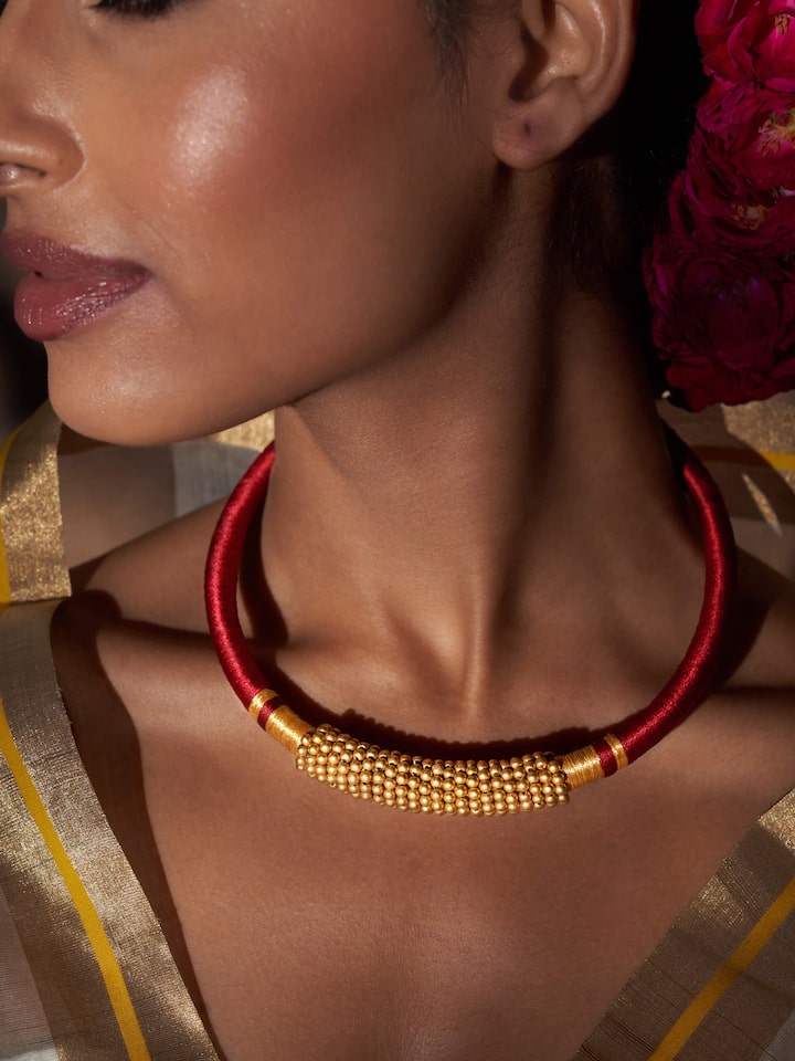 Close-up shot focusing on the fine gold work and texture