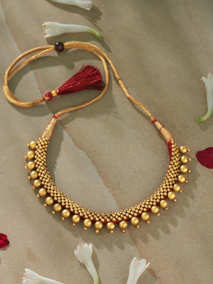 Angled shot revealing the choker’s elegant curves and finish