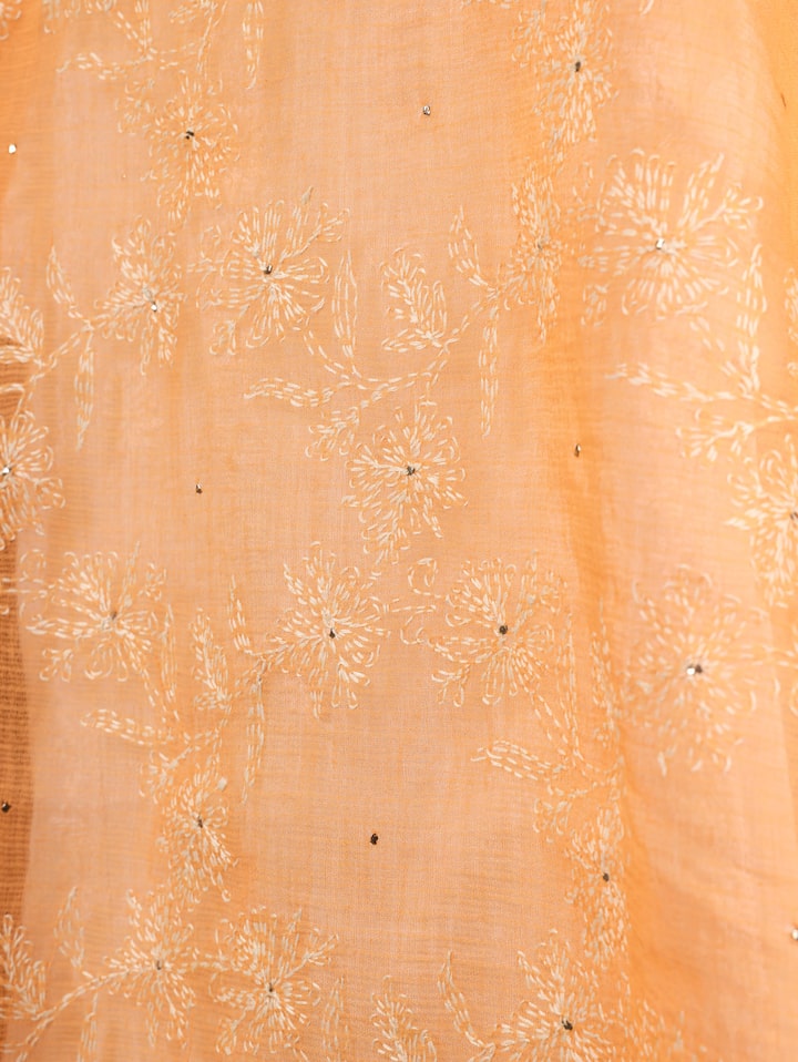 Side profile showcasing the smooth flow and exquisite craftsmanship of the fabric.