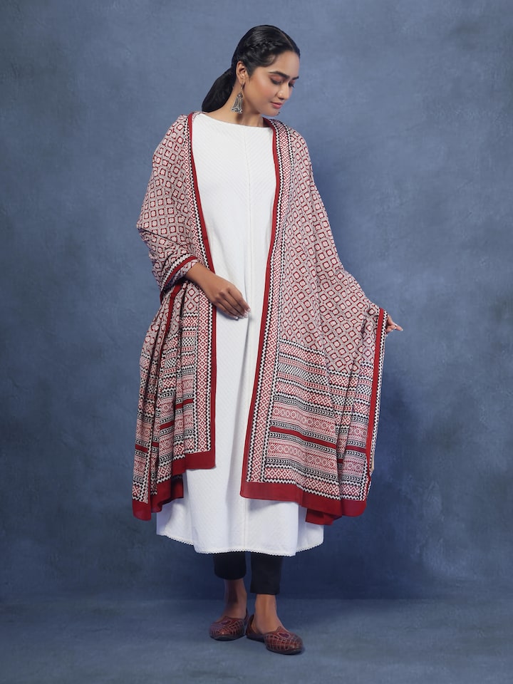 Lifestyle view of red Bagh print dupatta draped with ethnic attire for a vibrant look