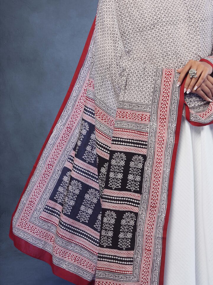Displayed on a stand, emphasizing the full length and pattern of the cotton stole.