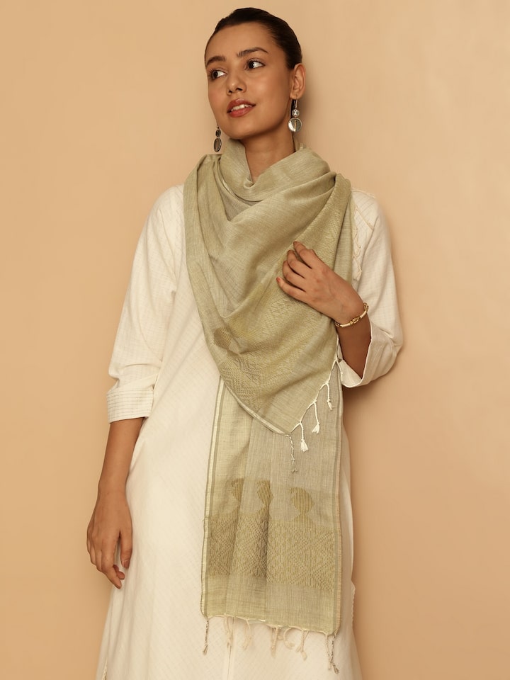 Close-up side view showing detailed weaving and soft fabric texture of yellow cotton extra-weft stole.