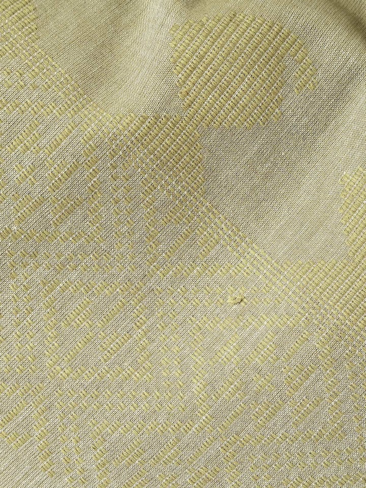 Folded yellow cotton extra-weft stole emphasizing its smooth finish and vibrant color.