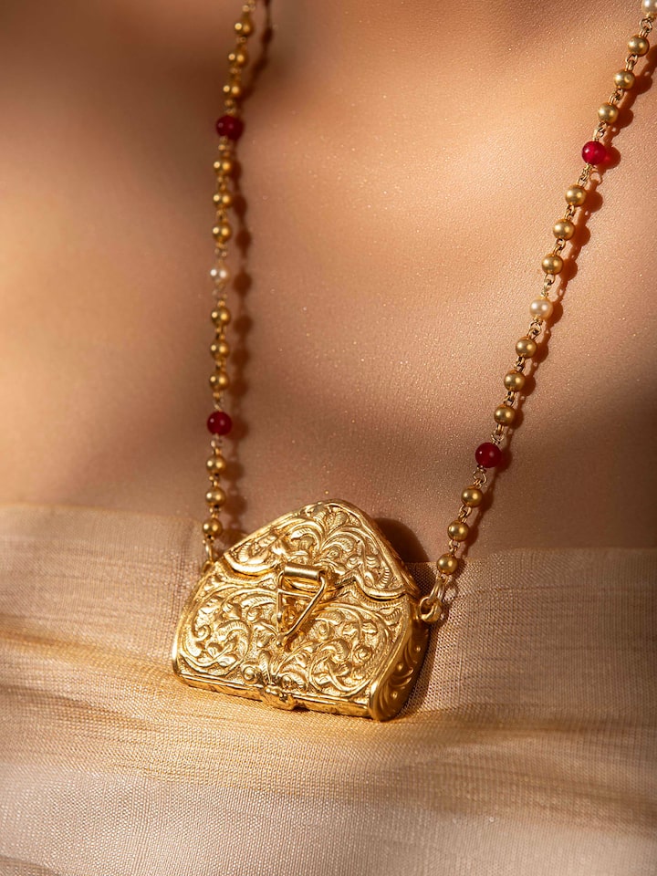 Side view of Chitai Silver Long Necklace displaying the elegant profile.