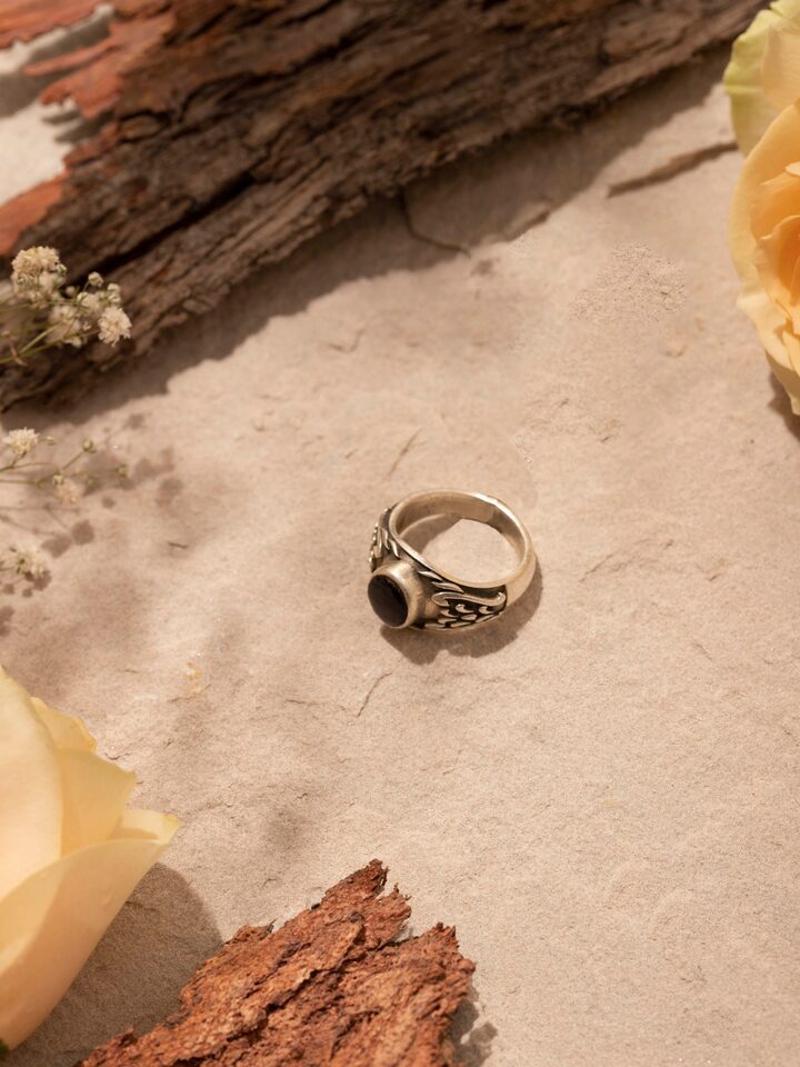 Side view of Chitai Silver Ring highlighting the detailed silverwork and band design.