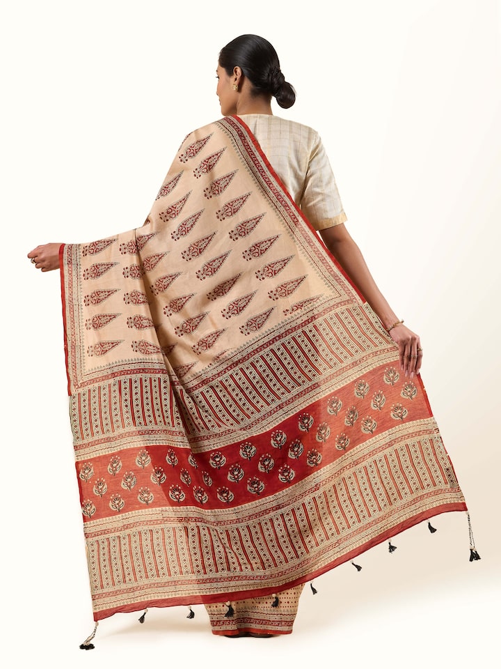 Back view of Beige & Red Cotton Natural Dyed Bagru Block Printed Saree showing the pleats and finish