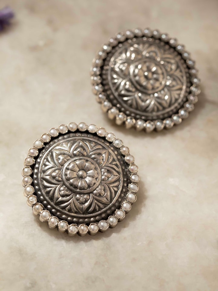 Detailed view of Silver Smithing stud earrings showcasing fine craftsmanship and stylish design