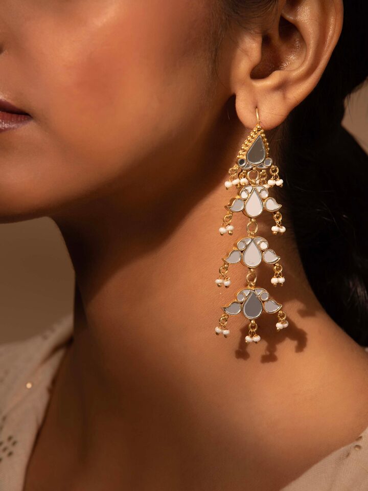 Side view of Silver Smithing Drop Earrings highlighting the detailed silver craftsmanship and stylish drop design.