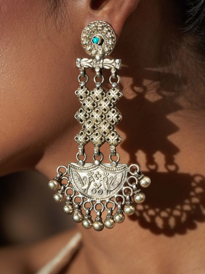 Detailed close-up of Silver Smithing Chandelier Earrings showcasing the refined silverwork and chandelier design.