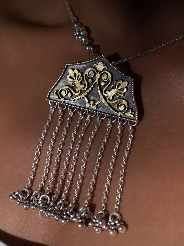 Overhead view of Silver Smithing Pendant featuring elegant design and intricate metal detailing.