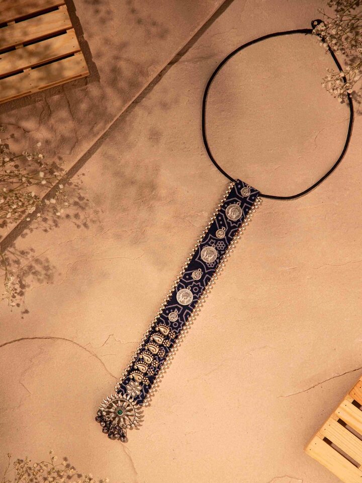 Lifestyle image showing how the necklace drapes when worn