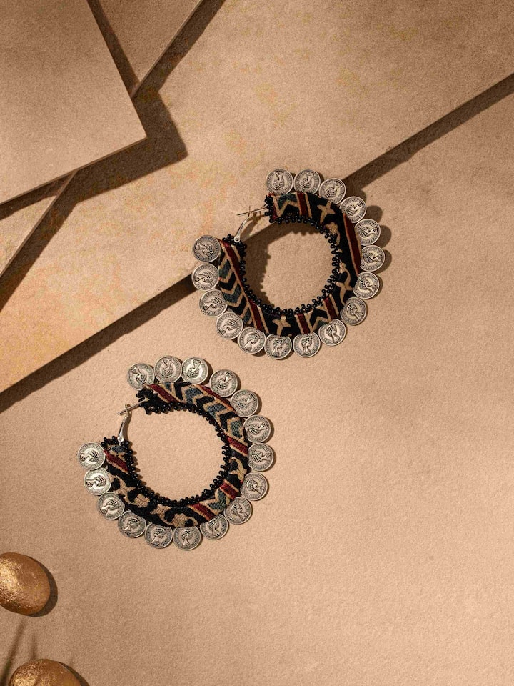 front view of ajrakh hoop earrings with traditional block print design
