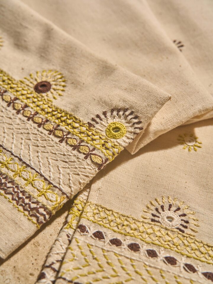 Side profile reveals the texture and understated elegance of the fabric.