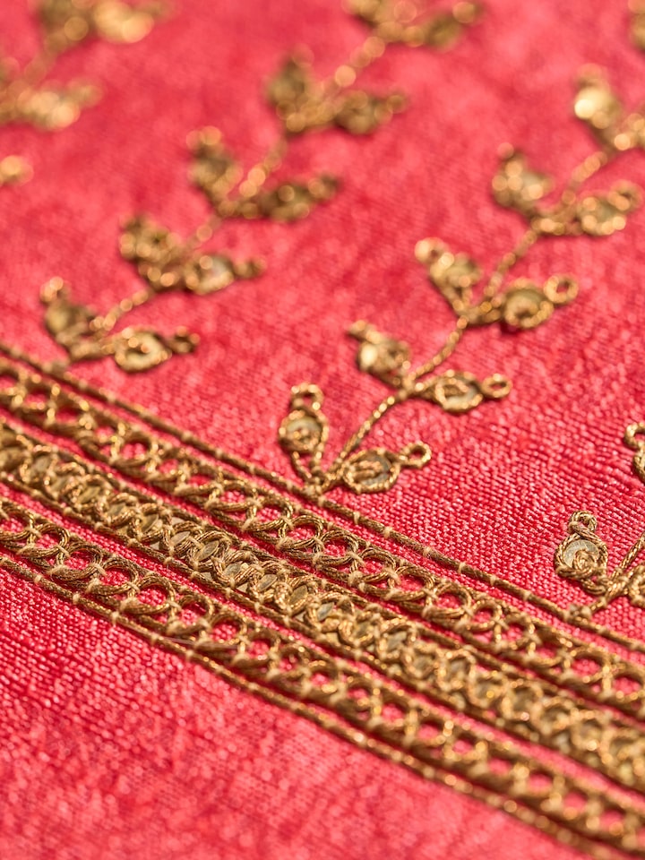 Close-up detail shot of pink Tussar silk blouse piece showcasing intricate gold Zardozi work