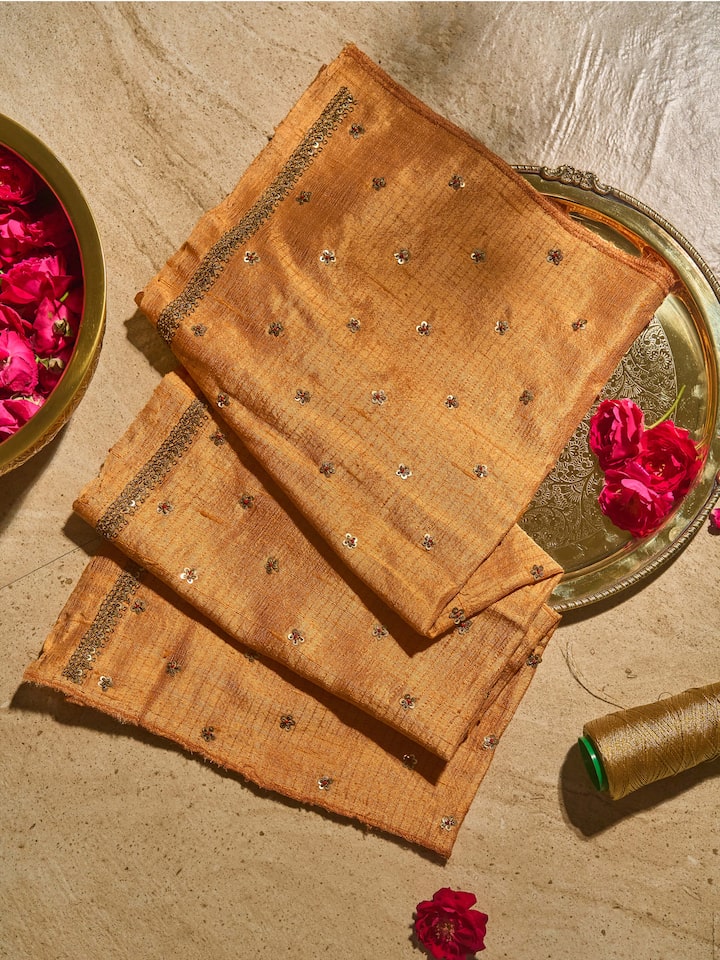 Lifestyle view of Rust Tussar Silk Zardozi Embroidered Blouse Piece showing embroidery details and fabric texture