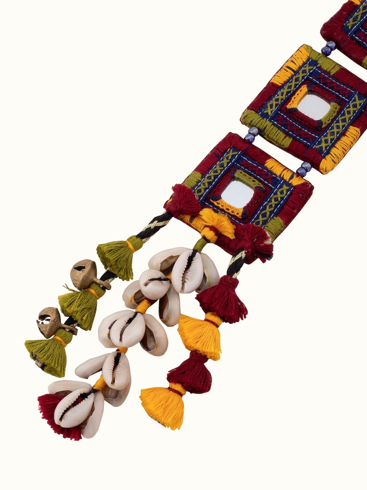 Overhead view of Banjara embroidery long necklace showing its full design and vibrant colors.
