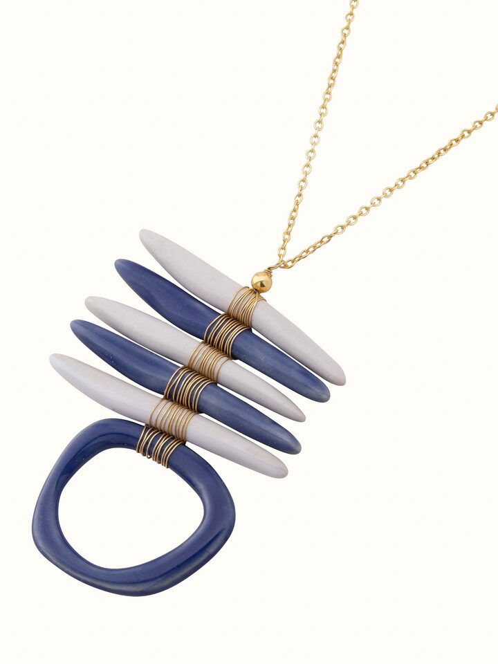 Angled view of ceramic long necklace showcasing its stylish drape and design