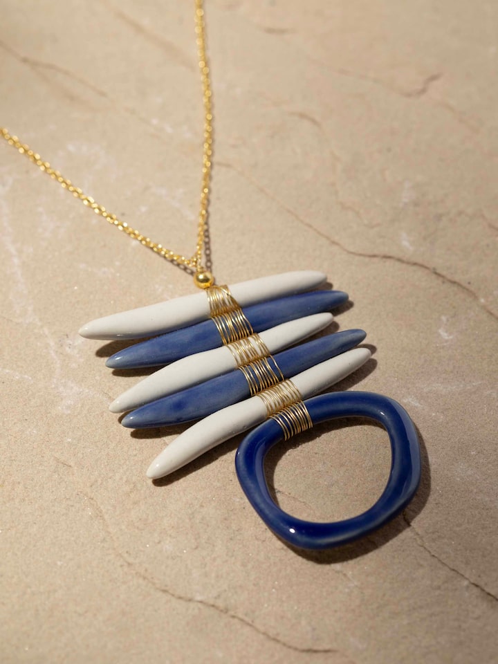 Detailed front view of ceramic long necklace highlighting its artistic bead arrangement