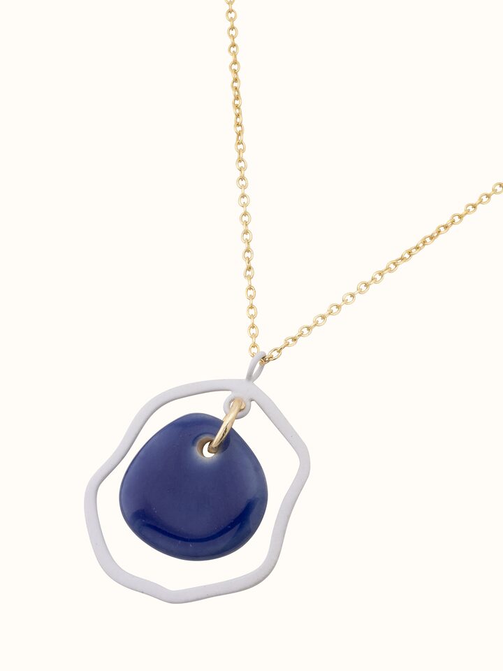 Overhead view of ceramic long necklace showcasing its full length and design.