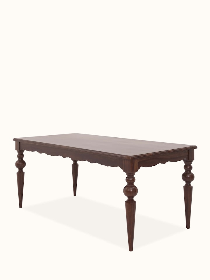 Close-up view of the Sheesham wood dining table, focusing on the detailed craftsmanship and grain of the teak finish.
