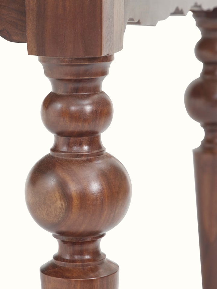 Angled view of the 6-seater dining table showcasing the table's expansive top and elegant legs.