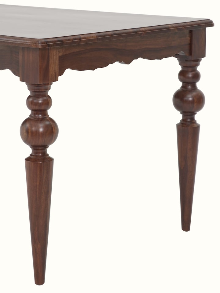 Top-down view of the teak finish Sheesham wood dining table, illustrating its spacious and polished surface.