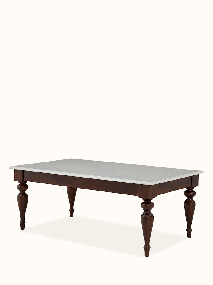 Angled view of Sheesham wood & marble coffee table, emphasizing the sleek design and elegant craftsmanship.