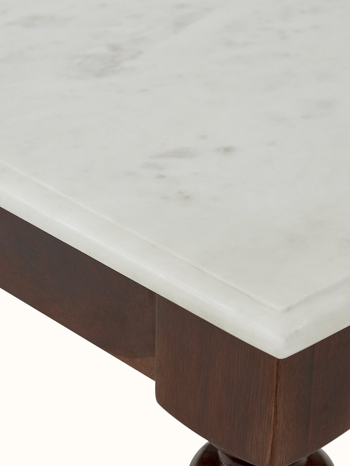 Detailed shot of the marble top and Sheesham wood frame of the coffee table, highlighting the quality materials.