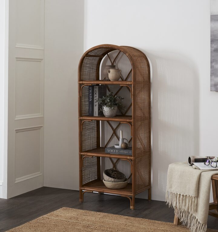 Side view of the cane bookshelf highlighting the intricate cane weaving and sturdy design