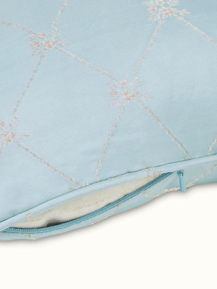 Detail view of Mandana Light Aqua Trellis Silk Banarasi Brocade Handloom Lumbar Cushion Cover highlighting the fabric texture and embroidery detail