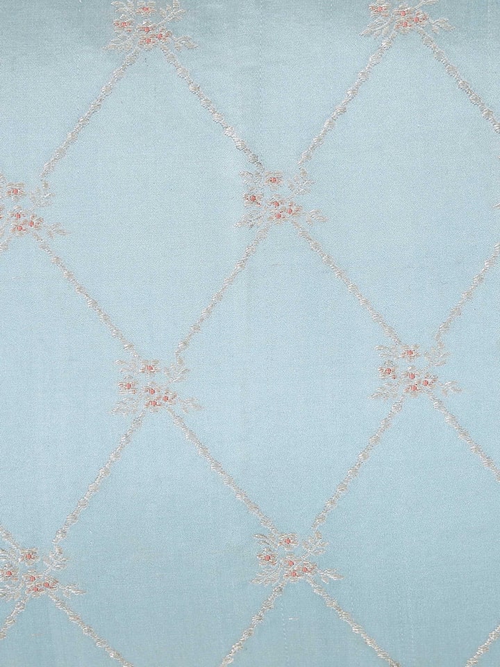 Detail view of Mandana Light Aqua Trellis Silk Banarasi Brocade Handloom Lumbar Cushion Cover highlighting the fabric texture and embroidery detail...