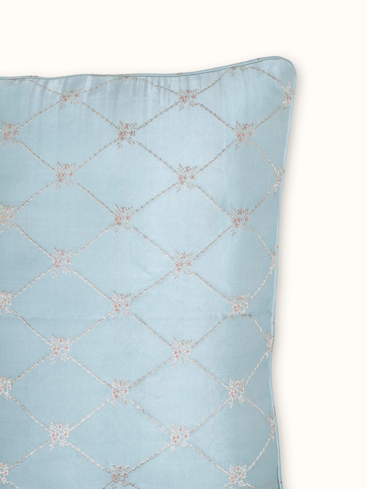 Detail view of Mandana Light Aqua Trellis Silk Banarasi Brocade Handloom Lumbar Cushion Cover highlighting the fabric texture and embroidery detail...