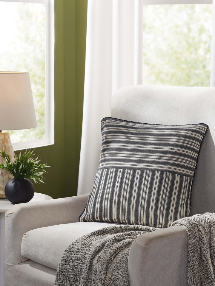 Front view of Ujjal black kaya cotton handloom cushion cover, highlighting its sleek design and luxurious fabric.