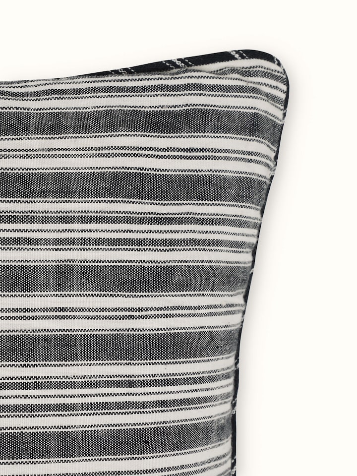 Close-up of Ujjal black kaya cotton handloom cushion cover, emphasizing the fine handloom weave and rich black color.