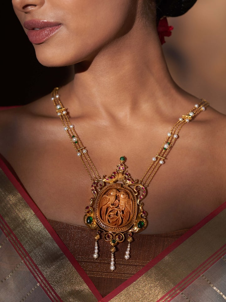 Side view of carved wood & silver long necklace highlighting the unique design and craftsmanship