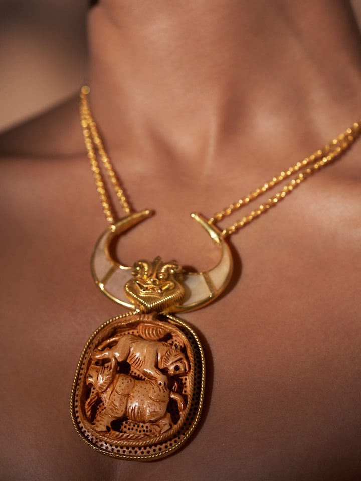 Close-up view of Carved Wood & Silver Long Necklace highlighting the stone setting and metalwork detail