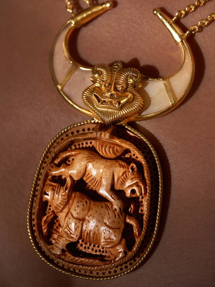Detail view of Carved Wood & Silver Long Necklace highlighting the stone setting and metalwork detail