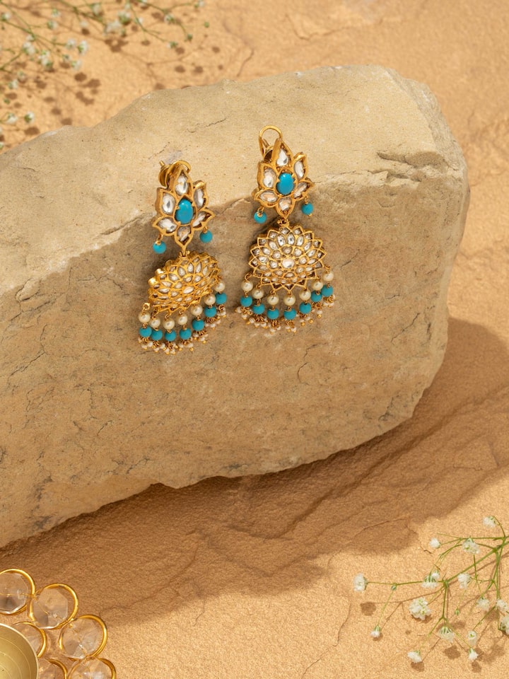 Overhead view of Bandhel metal drop earrings displaying the overall shape and style