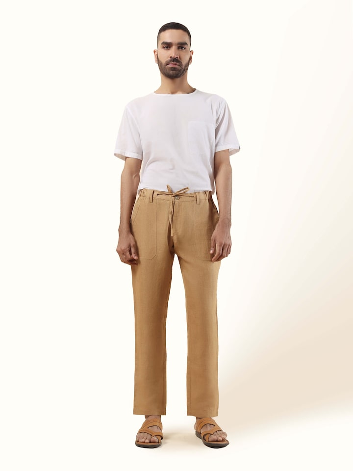 Front view of beige linen lounge pant with elasticated waist and straight-leg relaxed silhouette