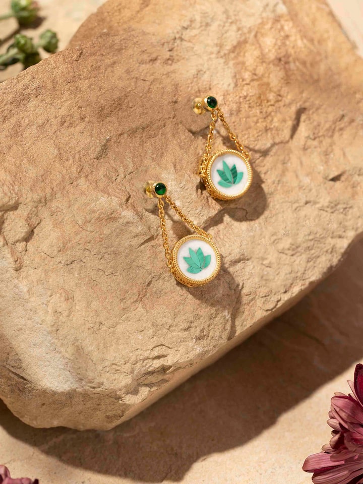 Side view of Pacchikari silver drop earrings emphasizing their elegant drop shape and craftsmanship.
