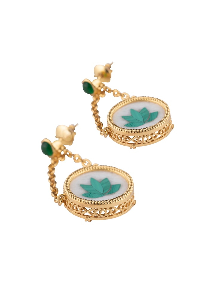Pacchikari silver drop earrings displayed on a flat surface showing their elegant design and fine craftsmanship.