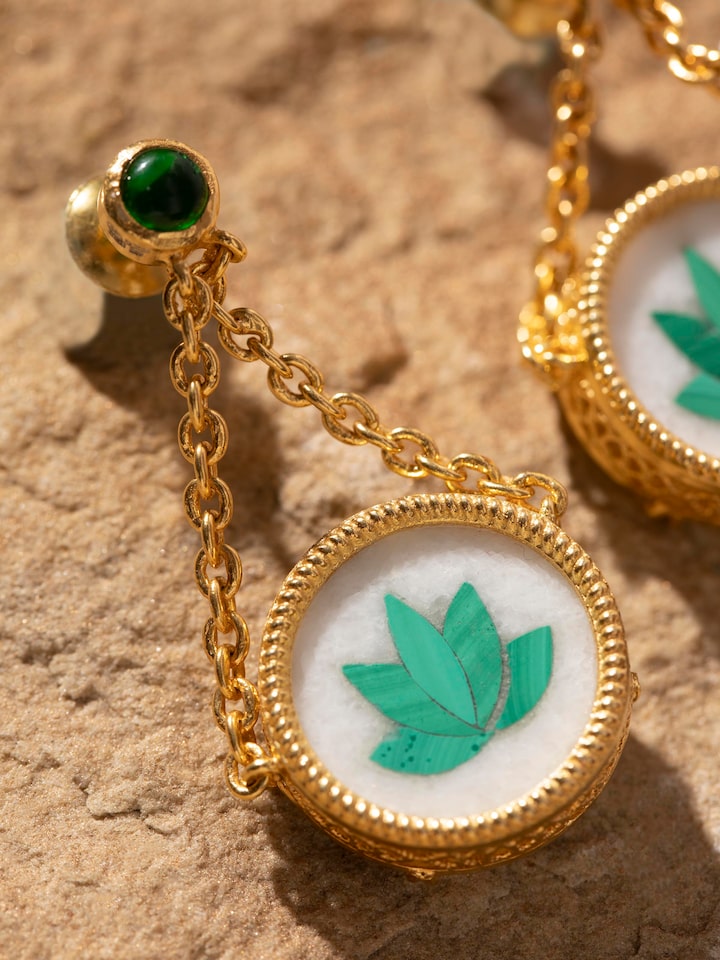 Detailed view of Pacchikari silver drop earrings highlighting their intricate patterns and traditional appeal.