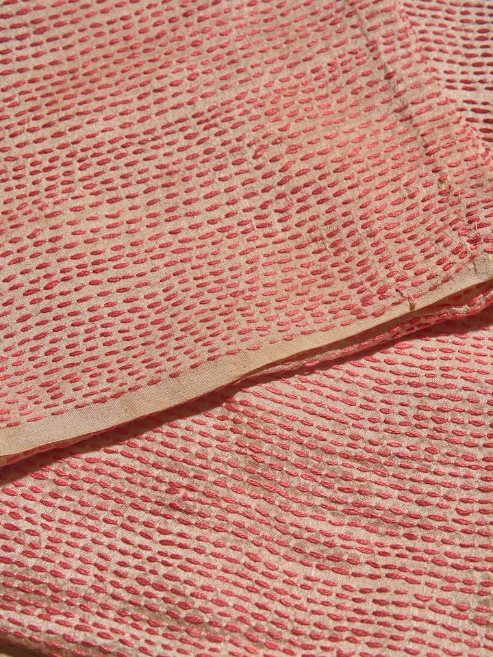 Side angle of off-white tussar silk blouse piece showcasing Sujani embroidered designs and texture.