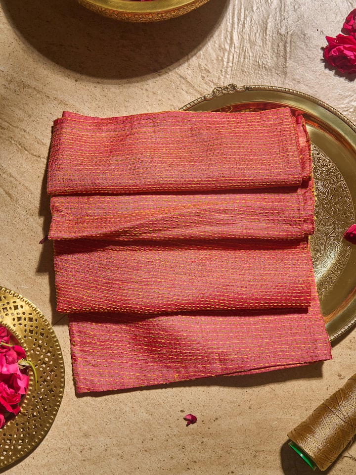 Lifestyle shot featuring the blouse styled with a traditional saree.
