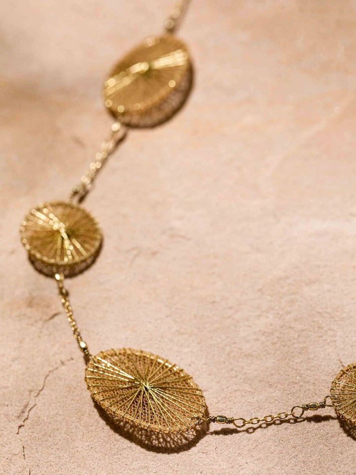 Detailed front view of string craft long necklace showcasing its vibrant and intricate pattern