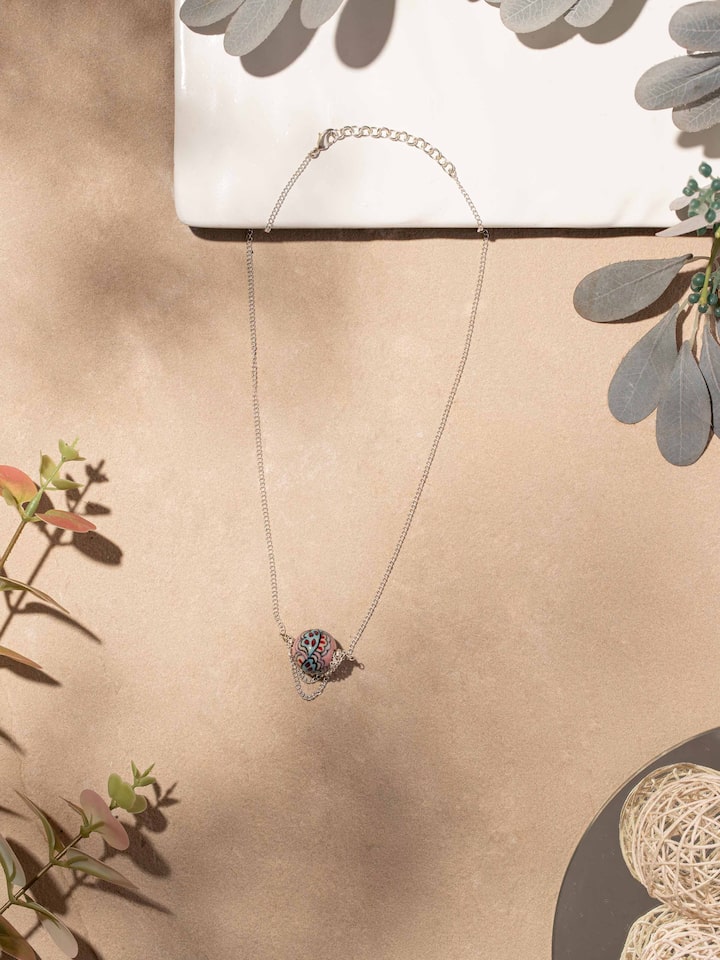 Close-up view of Ceramic Long Necklace emphasizing the fine craftsmanship and detailed ceramic design.