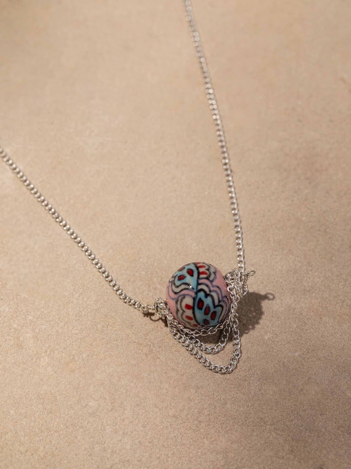 Detailed view of Ceramic Long Necklace from a distance, displaying its full length and design elements.