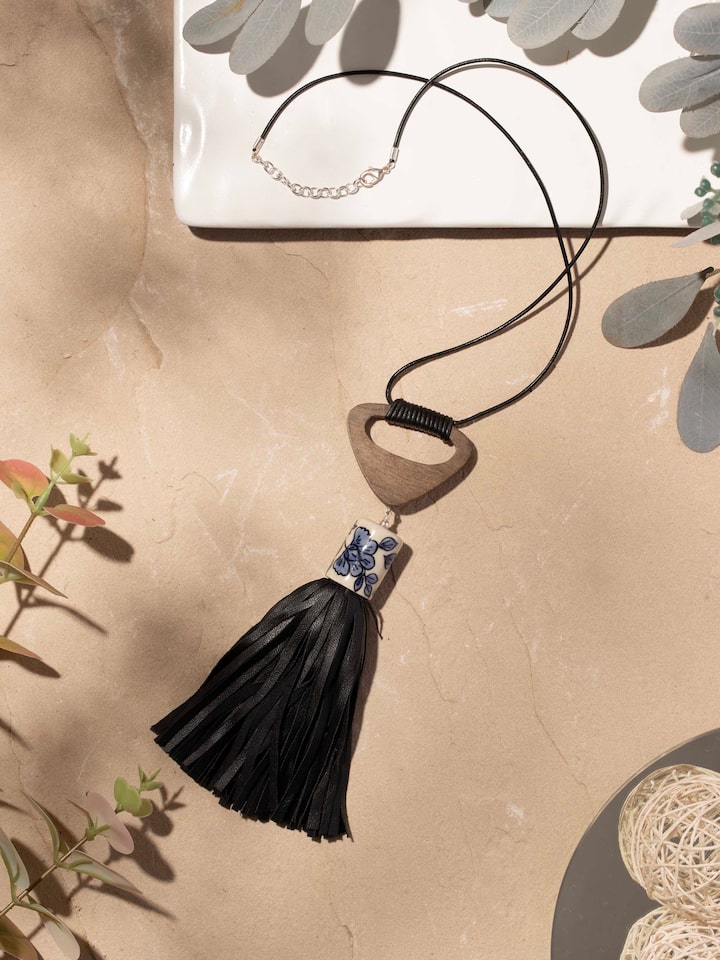 Close-up view of ceramic long necklace showcasing detailed design and texture