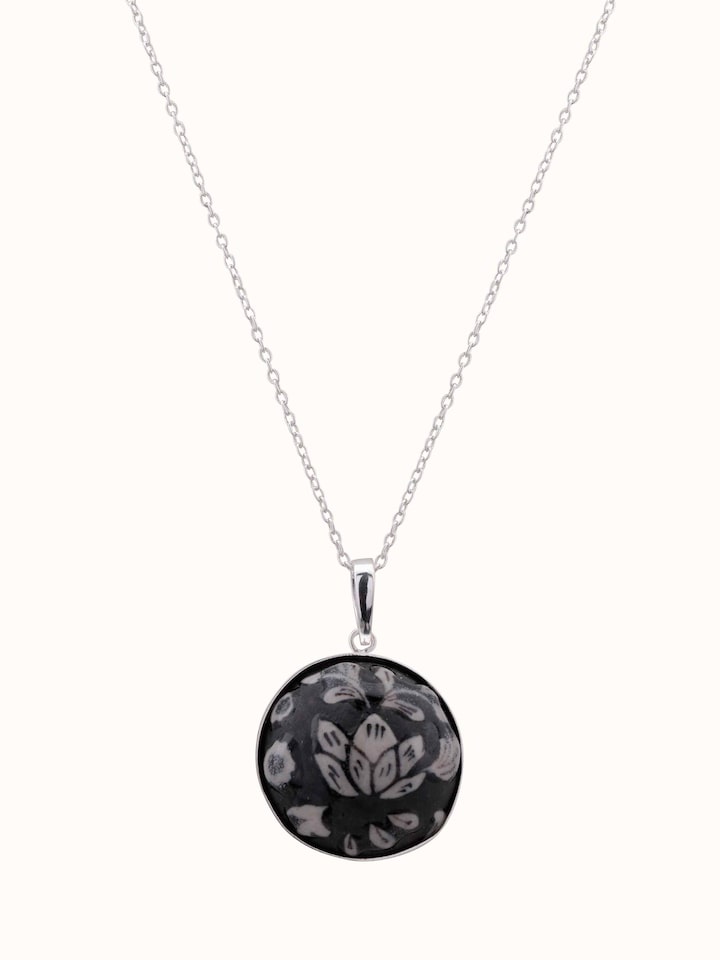 Front view of ceramic pendant and chain featuring a unique design and vibrant colors